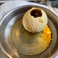 Pani Puri: Hollow fried dough balls filled with black chickpeas, potatoes, and spicy water at 55 Bombay Street in Rotterdam