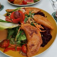 Large vegan salad with four fried pierogies (filled with dried tomatoes, spring onions, zucchini) at Malinas in Dusseldorf