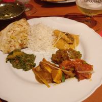5 vegan dishes with rice and garlic naan (as a large group we let the owner decide for us and we were all amazed by all the different spices and the delicious naan bread; the garli at Royal India in Ghent