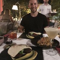 Our vegan burgers which came in pita bread, and a vegan risotto as a side. at Çoko in Tirana