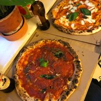 One vegan marinara pizza and one vegetarian with mozzarella  at MANU+ in Budapest