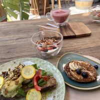 Vegan breakfast menu - avocado bread, pancake, yoghurt with fruits and beetroot latte  at Peanut's Café in Sainte-maxime