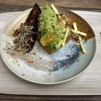 Avocado toast, I asked to take out the egg and the feta to make it completely vegan.   at Peanut's Café in Sainte-maxime