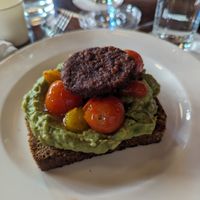 Avocado toast with a plant based breakfast patty at Jack's Stir Brew Coffee - Tribeca in New York City