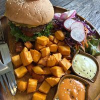 Mushroom bean burger with home made fake cheese sauce and sweet potatoes   at Pure Vegan Heaven in Koh Samui