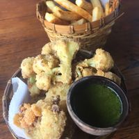 Cauliflower wings and fries (25k each) at Shelter Cafe in Seminyak