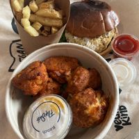 Burger, fries and cauliflower wings, plenty of sauces    at Flipside in London