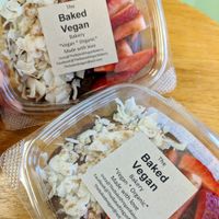 Raw gluten free chocolate avocado mousse with coconut flakes, berries, cacao nibs, cinnamon and hemp seeds at The Baked Vegan Bakery in Lake Park