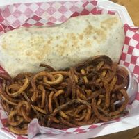 Phat Burrito and curly fries. So good 😀  at Blue Sage Vegan Bistro in Little Rock