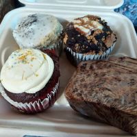From upper left going clockwise: S'mores muffin, lemon poppy seed muffin, chocolate chip banana bread, red velvet cupcake. All vegan at Cafe Single Fin in Pensacola