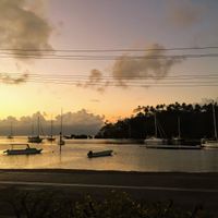 Beautiful sunset view over the harbor and Nawi island right outside. at Sea Lovers in Savusavu