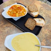 Syrian soup on the top left, cauliflower cream on the bottom. Comes with two slices of bread  each.  at Jelo in Weimar