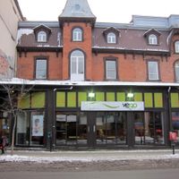 Front of Commensal, now rebranded as Resto Végo. (Also, a random me who had no idea she was going to be in the photo, else she might have turned around and smiled). at Commensal - St Denis in Montreal