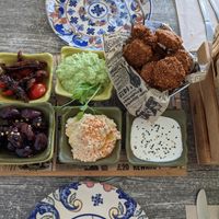 Family Platter: Home-made falafel balls, mint pea, tahini, hummus dips, olives, cherry and sun-dried tomato with balsamic glaze, served with warm ftir at Balance Bowl in Gzira