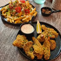 The calamari and loaded fries are both fantastic! at Balance Bowl in Gzira