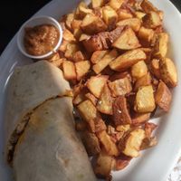 Vegan breakfast burrito and breakfast potatoes at Herms Inn in Logan