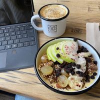 Mango and passion fruit frozen bowl with a golden latte ❤️ at Wild & The Moon - Saint Honoré in Paris