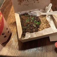 Black bean rice box and waffle fries   at LEON - Shaftesbury Avenue in London