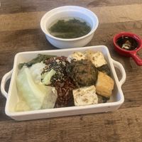 Rice dish with seaweed ball, tofu and veggies. Served with soup  at Mang's Mania in Ho Chi Minh City