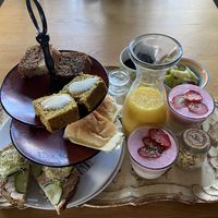 Breakfast for 2: banana bread (the best!), lemon cake, white buns with cheese (normal and cumin), toast with cream cheese and strawberry soy yoghurt with toppings.  at Villa La Vida in Egmond Aan Zee