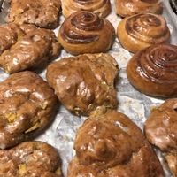 Vegan cinnamon buns and vegan apple fritters; freshly made every day! at Coffee Time in Bolton