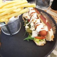 Moving Mountains Hot Dog in a pretzel bun with popcorn at Seashells Healthy Living in Limassol
