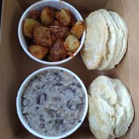 Biscuits and gravy with a side of roasted potatoes at Essen Kitchen in Cincinnati