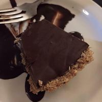 Choco-Banane Tart: Delicious smooth and creamy chocolate filling with a fresh banana flavour inside a flaky, tender pastry crust. at Aux Vivres - St Laurent in Montreal