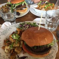 Poutine and burgers with potatoes and salad  at Aux Vivres - St Laurent in Montreal