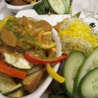 Royal Poutine... it's not on the menu very often, but don't picture a greasy poutine, it's more like veggies on big oven fries with gravy. It's still delicious. at Aux Vivres - St Laurent in Montreal