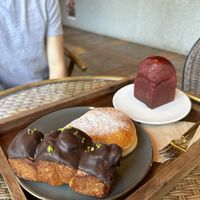 Chocolate covered cinnamon bun, soy cream pastry, and red rice flour bread  at Doco - City Farm House Cafe in Busan