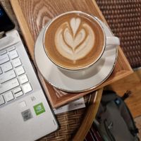 Latte with oatmilk at Doco - City Farm House Cafe in Busan