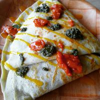 Vegetarian lentil crepe with extra pesto, sweet pepper sauce and mango habanero drizzle👌 at Unity Cafe in Parkersburg