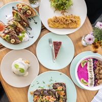 🙈 Waffles, “omelet”, smoothie bowl, “cheese”cake, cinnamon bun and ciabatta with beans and fake meat 😋😋😋 at I Am Vegan Babe in Canggu