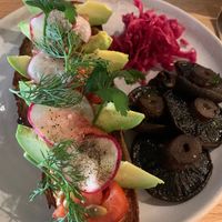 Avocado sourdough with tomato, relish, radish, dill, seeds, kraut and I added mushrooms. Delicious, healthy and fresh food.  at Felix For Goodness in Brisbane