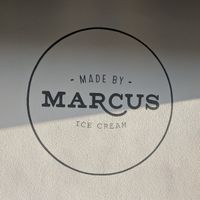 Mural logo on exterior at Made By Marcus - Hillhurst in Calgary