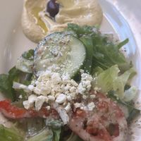 Greed salad and hummus side that came with Vegetarian Falafel Plate   at Petra Cafe in Hattiesburg