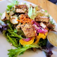 Salad veganized with added avo and grilled tofu. Was delicious. Dislike extra charges when removing dairy n not a substitute. at Cafe Phoenix in Arcata