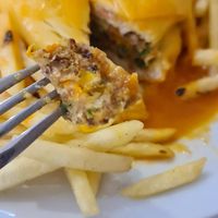 Super tasty and original vegan option. The vegab francesinha is made with a homemade quinoa burger, the bread is a 'bolo do caco' (without any animal ingredients) and vegan cheese. at Pimenta Doce in Viana Do Castelo