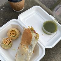 Pani puri w/ green chutney, pickled pakora wrap, masala chai. This is over 60% eaten already - originally there was 6 pani puri & 1 additional wrap. at Snackwallah in Newcastle Upon Tyne