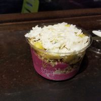 Smoothie bowl with pitaya, pineapple, coconut, etc.  Delicious! at SoHo Juice Co in Winter Park