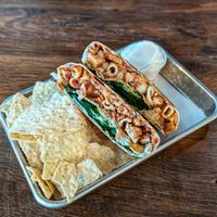 Chick'n Parm Crunch, tortilla crisps, sour cream at Leguminati Vegan Eatery in Orlando