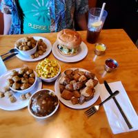 Original chick'n sandwich, okra, potato wedges, mashed potatoes and gravy, macaroni and cheese, lemonade, and sweet tea at Binge Kitchen in San Antonio