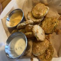 What is left of the fried pickles. Sooo good!  at Binge Kitchen in San Antonio
