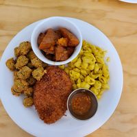 Coconut crusted chick'n with Mac and cheese, fried okra and candied yams at Binge Kitchen in San Antonio