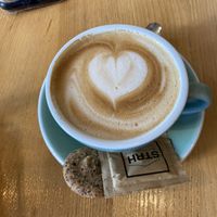 flat white with oat milk (cookie isn’t vegan)  at Strh Cafe & Gallery in Zakopane