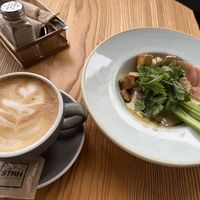 Cap with oat milk, vegan protein bowl  at Strh Cafe & Gallery in Zakopane