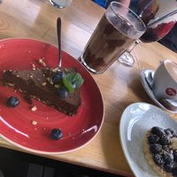 Vegan chocolate cake, a fruit tarte and a vegan iced coffee.  at Strh Cafe & Gallery in Zakopane