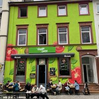 The building with the outdoor seats  at Veggie Liebe in Freiburg