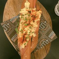 Supreme dog (Moving Mountains sausage wrapped in bakon, mac and cheeze, mayo, greens)  at Unity Diner in East London